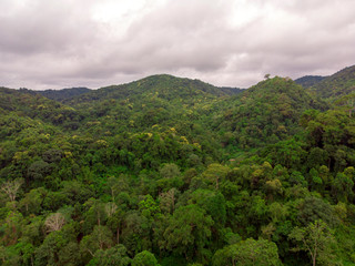 High angle viewpoint over rainforest mountains in Thailand.