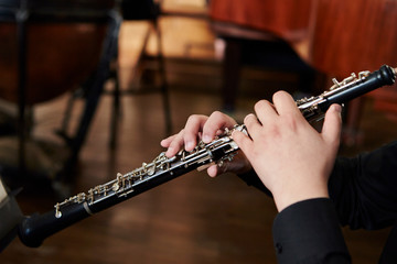 Playing the oboe, hands close up 