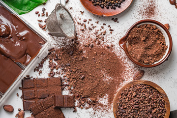 Cocoa beans pods, chocolate bar pieces, cocoa powder