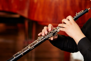 Playing the oboe, hands close up 
