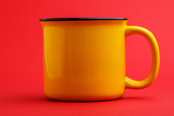 iron mug, on red background.