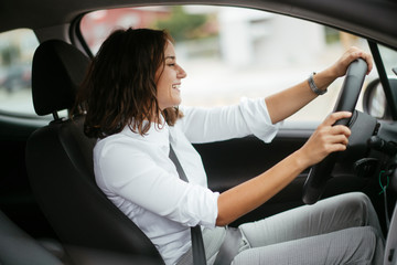 Young businesswoman in car