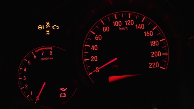 Close up of car dashboard with visible speedometer