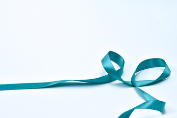 Aquamarine curly ribbon on white background, decorative elements