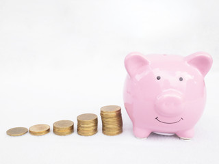 Pink piggy bank with coins bar graph, Saving money for future plan and retirement fund concept