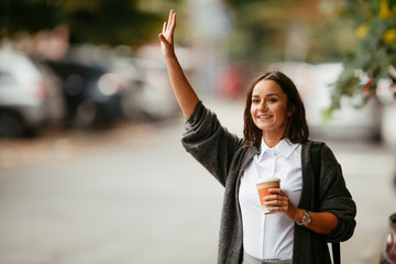 Young girl calling taxi