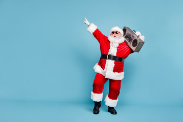 Full length body size view of his he nice cool trendy stylish fat cheerful cheery glad excited bearded Santa carrying tape player dancing isolated over blue turquoise pastel color background