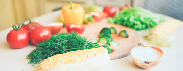 Seasonal vegetables on a bright kitchen table.