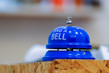 blue bell on wood table.