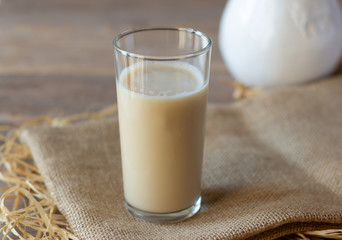 Oat milk in glass. Alternative lactose free vegan friendly plant milk