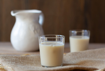 Oat milk in glasses. Alternative lactose free vegan friendly plant milk