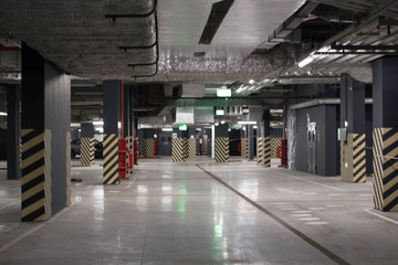 Underground public garage parking with cars, movie style toned