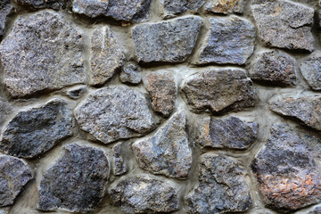 Old rock wall. Natural light. Close-up. Texture.
