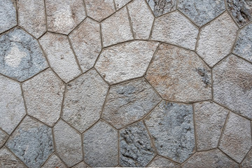 Fragment of a mosaic of stones. Floor covering.