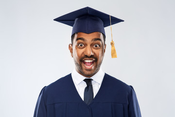 education, graduation and people concept - happy excited indian male graduate student in mortar...