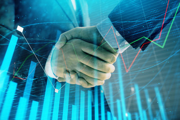 Multi exposure of forex graph on abstract background with two businessmen handshake. Concept of success on stock market