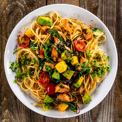 Spaghetti with chicken meat, avocado,mango and cherry tomatoes
