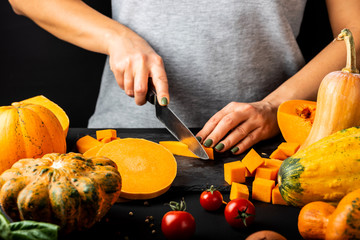 Preparing pumpkin on the table. Vegetarian healthy diet food concept.