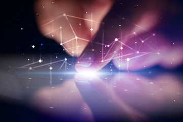 Finger touching tablet with global network concept and dark background