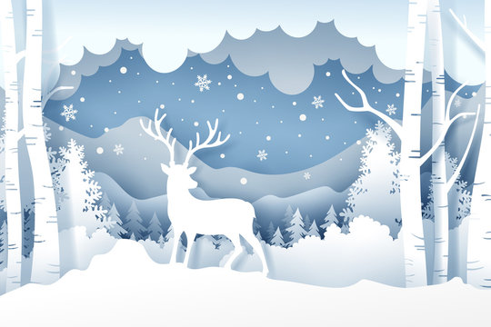 Christmas and deer in forest with snow in the winter season. Background of landscape paper art style © Kannapat