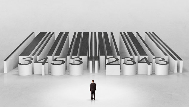 Young businessman standing in front of a big codebar