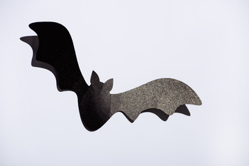 black paper bat on white background