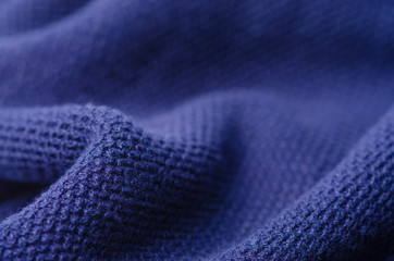 Blue knitted sweater fabric textile material texture macro blur background