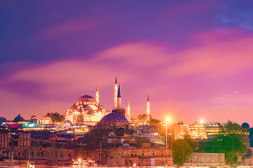 Fototapeta na wymiar Night Suleymaniye Mosque against dramatic sky. It's an Ottoman imperial mosque located on the Third Hill of Istanbul, Turkey.