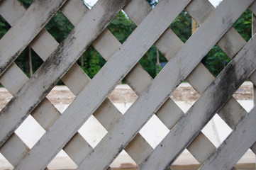 artificial wood wall, old condition, white and black spots