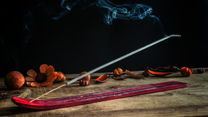 Fototapeta na wymiar Relaxing aromatherapy meditation incense stick with potpourri on background