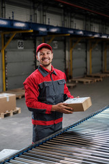 Warehouse worker working on a conveyor line