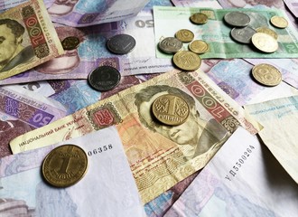 Ukrainian money hryvnia UAH. Banknotes of Ukraine with selective focus on metal coins 