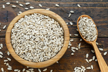 sunflower seeds on wooden background