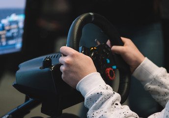 Playing with car simulator at an exhibition
