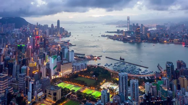Aerial drone hyper lapse or time lapse over Hong Kong at night. Central distinct of Hong Kong shot by 4K resolution drone, Victoria Harbor, Hong Kong