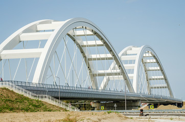 Novi Sad, Serbia - July 17. 2019: Zezelj bridge on river Danube in Novi Sad Serbia. The prospect of built New Zezelj Bridge viewed from the Petrovaradin side of the promenade