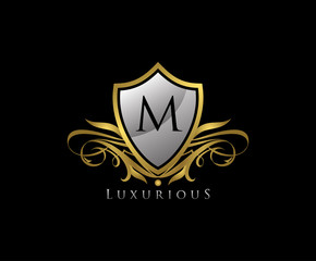 Fototapeta premium Luxury Gold Shield M Letter Logo Icon. Elegant M Letter Icon.