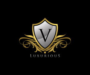 Obraz premium Luxury Gold Shield V Letter Logo Icon. Elegant V Letter Icon.