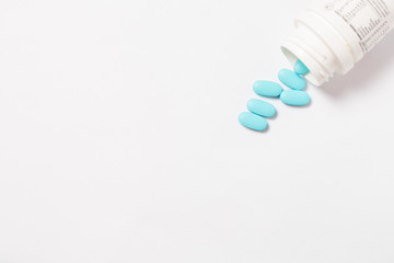 pills and bottle on white background
