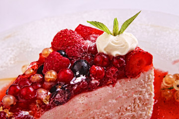 fresh cake pastry  tuck with barries on plate