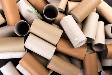 Cardboards sleeve from rolls of toilet paper. Out of toilet paper. Recycled cardboard cylinders from toilet paper. Close-up of empty toilet rolls.