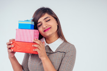 beautiful turkey woman giving gift boxes in studio white background.New year or Ekadashi concept