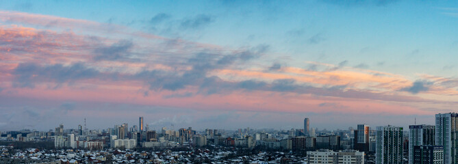 Dawn clouds over the metropolis of early winter morning