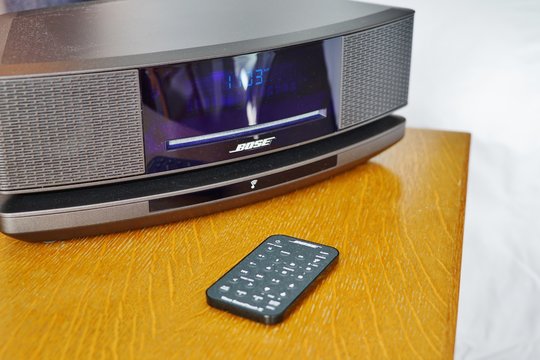 NEW YORK CITY, NY -4 OCT 2019- View of a Bose alarm clock sound system on a nightstand. Bose is a high-end audio equipment company.