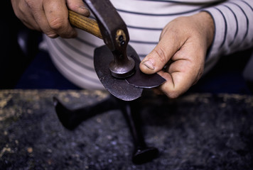 Traditional shoe making in workshop,stock photo