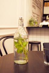 glass bottle on the table in the cafe
