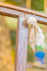 A rainy doll hanging on the clothesline