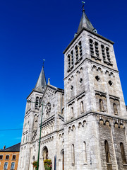 Fototapeta na wymiar Church of Notre-Dame de la Visitation in Rochefort, Belgium. Exterior sunny partial view