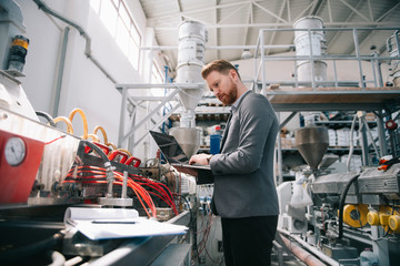 Manager checks machines at the factory. Inspector checks a factory.