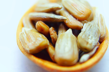 close up sun flower seed in wooden spoon